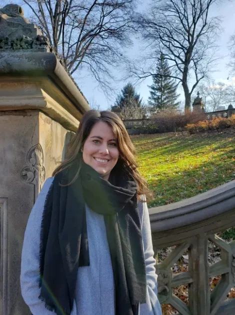 Candice Ebert standing outdoors in a coat and scarf